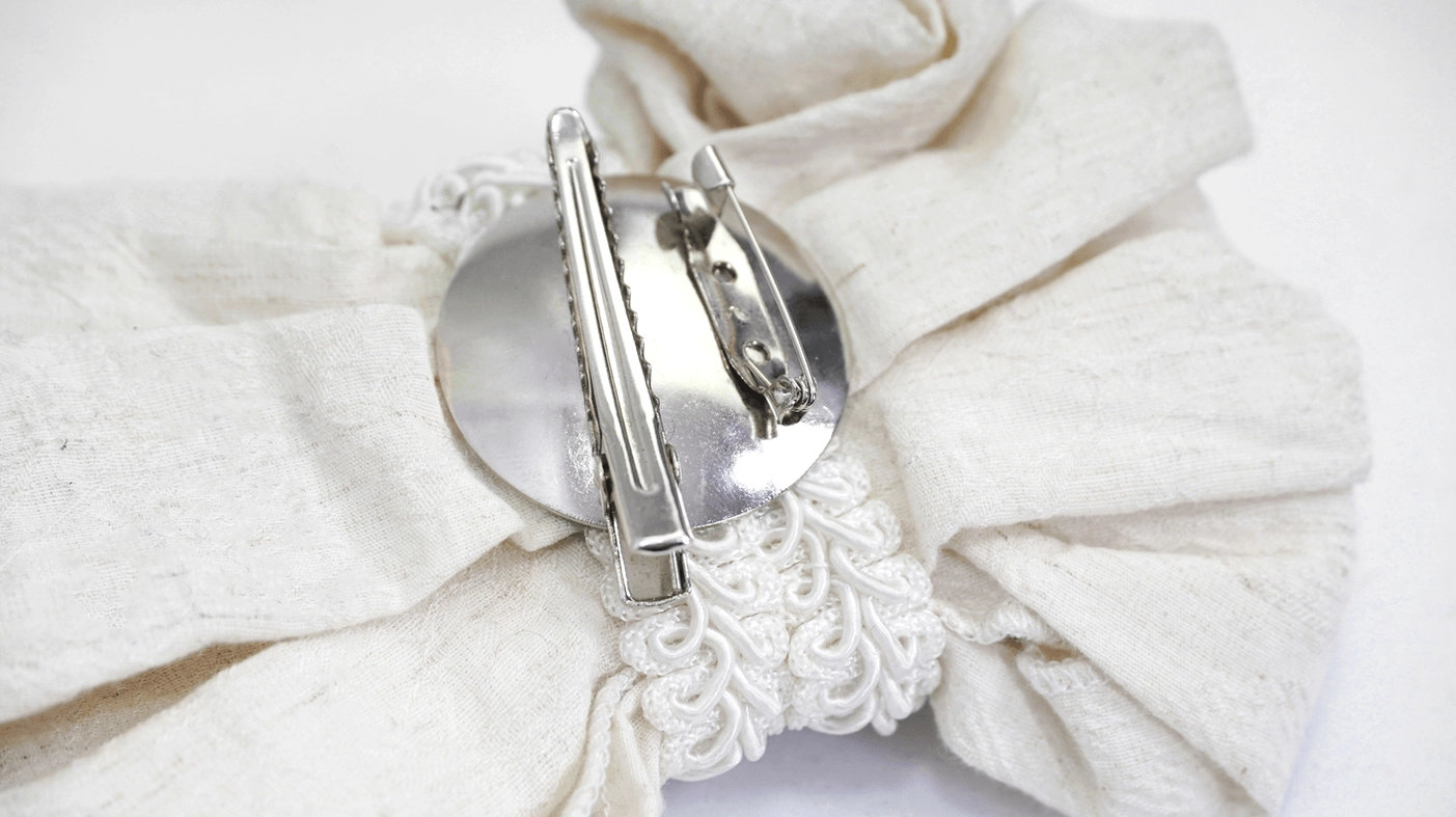 Back Detail of Gothic White Lace Jabot Showing Silver Metal Clasp and Lace Trim