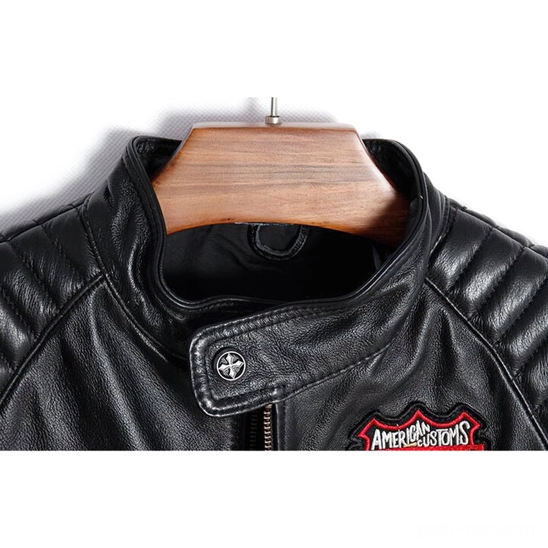 Close-up detail of black leather gothic jacket mandarin collar with quilted stitching and metal snap button