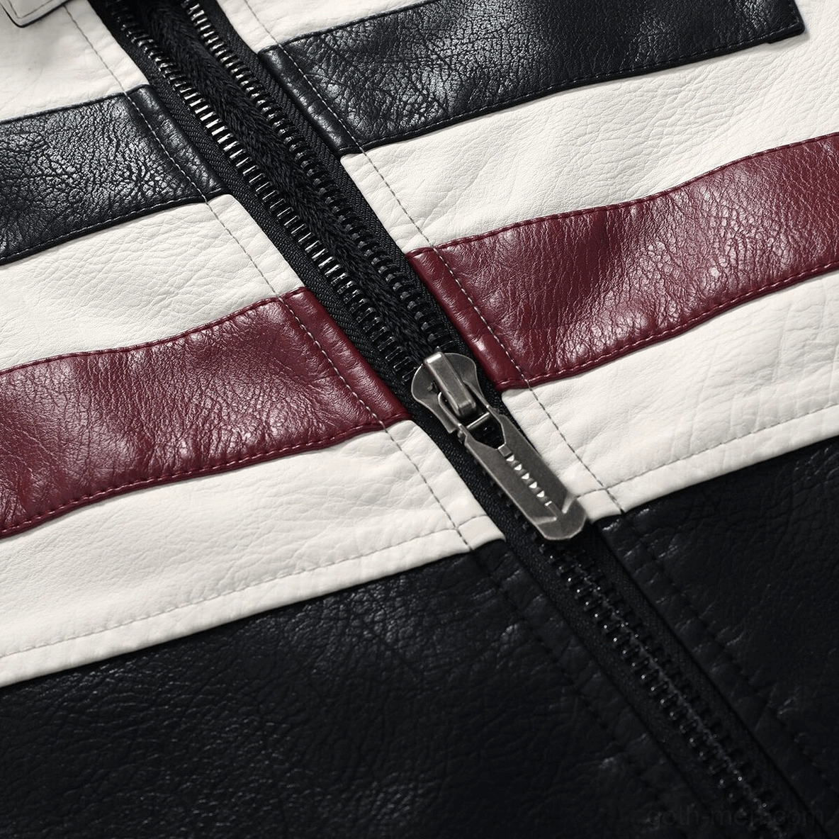 Front zipper mechanism and contrasting leather panel detail, metal hardware of gothic jacket