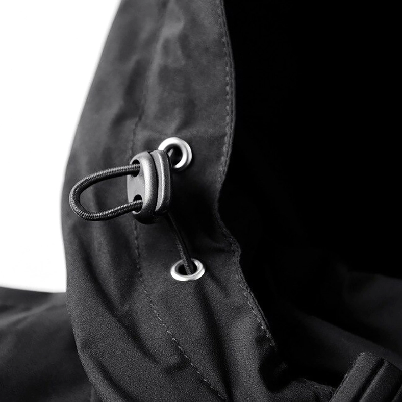 Men's gothic hooded jacket construction detail, showing hood drawstrings and attachment