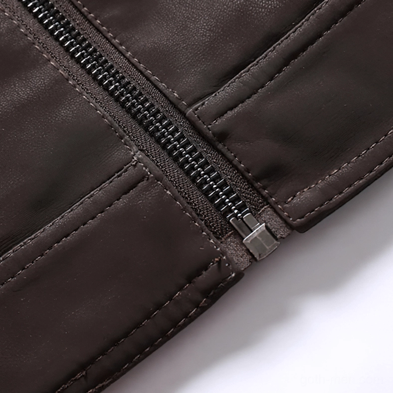Metal zipper hardware and seam stitching detail on brown PU leather gothic motorcycle jacket showing quality construction