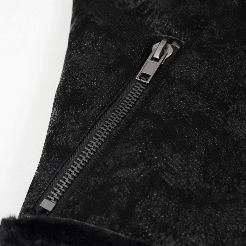 Close-up detail of metal zipper and cracked leather texture on gothic jacket