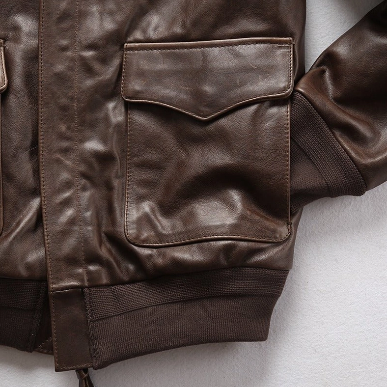 Gothic leather flight jacket shoulder and collar region showing structured design and embroidered graphic