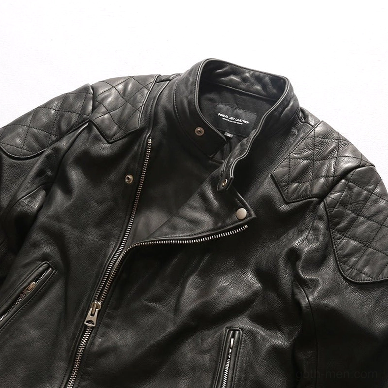 Black leather gothic jacket close-up of quilted shoulder pads and metal snap button hardware