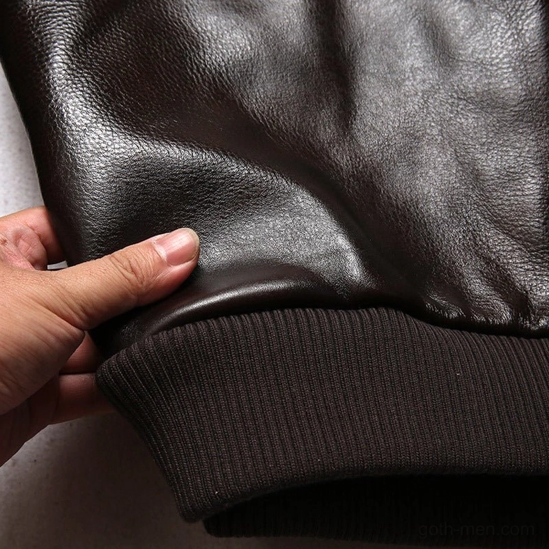 Side zipper detail of gothic biker jacket showing utility elements and structured leather panel