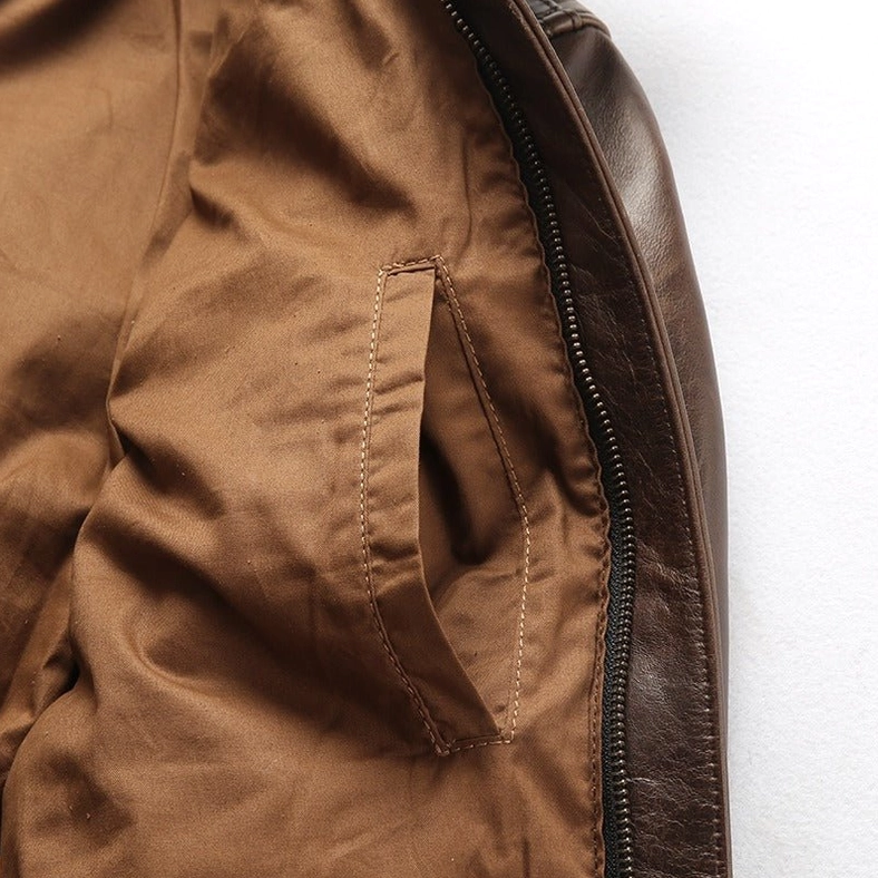 Close-up of gothic biker jacket sleeve and cuff details showing ribbed construction and zipper elements