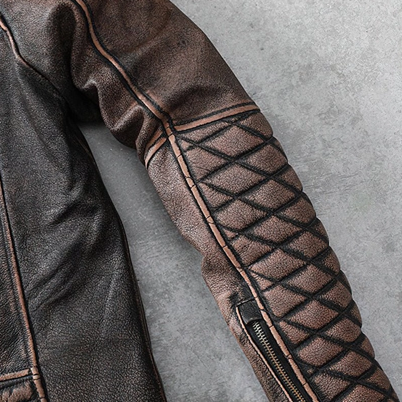 Brown leather biker jacket worn aesthetic detail emphasizing authentic gothic and vintage rebellion style