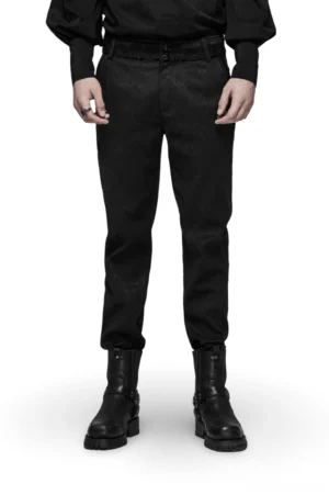 Black gothic jacquard lace slim-fit pants with metal accents, front view on male model