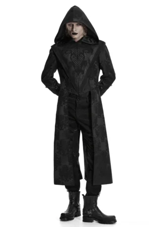 Male model wearing black hooded gothic jacquard tailcoat with embroidered detailing and gemstone cuff buckles, front full-body view