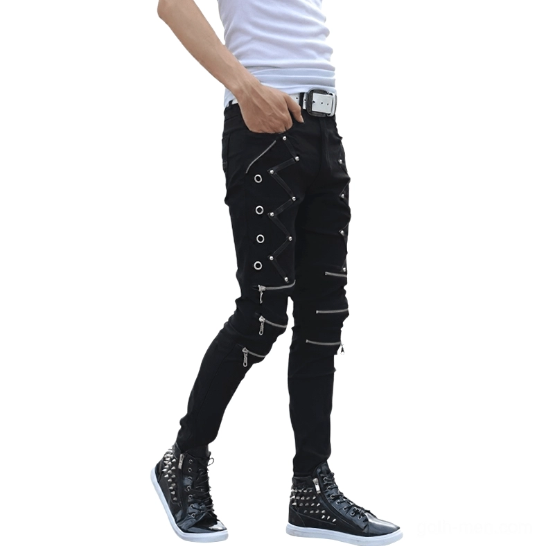 Black gothic skinny jeans men side view with metal zippers rivets and studded boots complete look