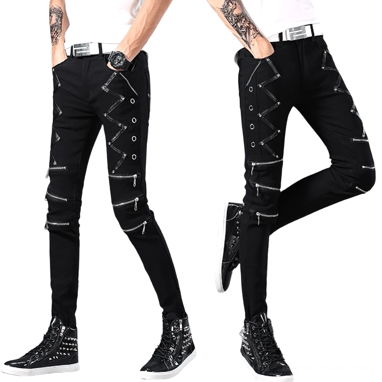 Black gothic biker jeans men worn with studded sneakers styled coordination - alternative fashion