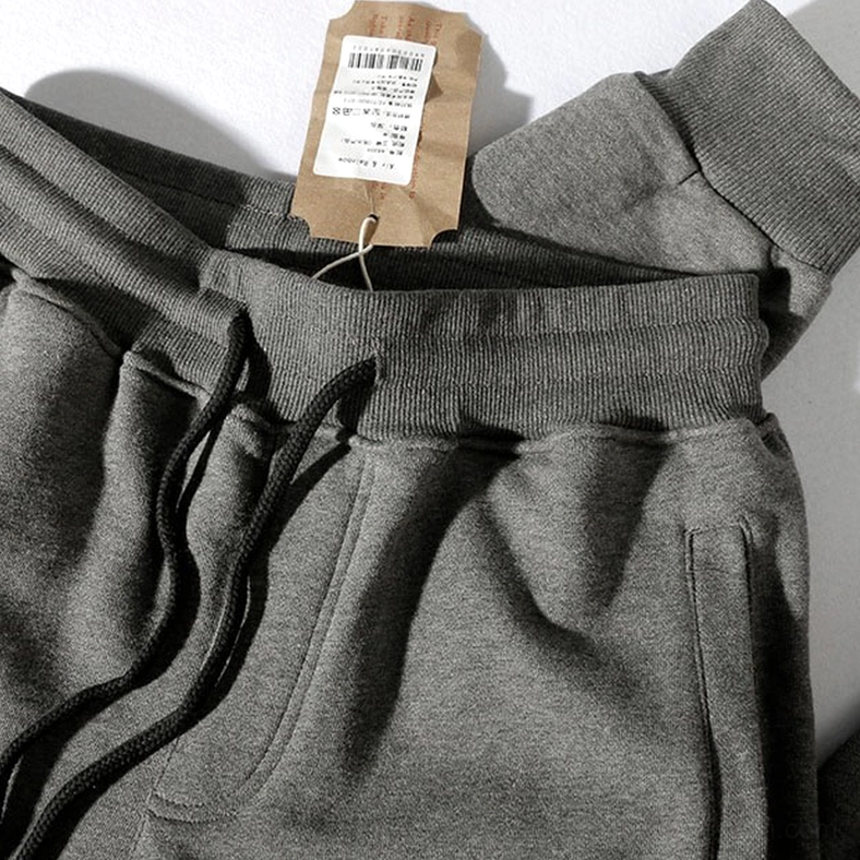 Close-up of elastic drawstring waistband and product tag on gothic alternative jogger sweatpants