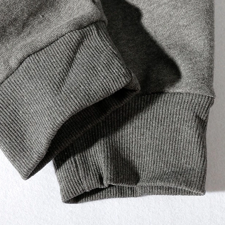 Alternative angle of NY embroidery logo on gothic jogger sweatpants, professional embroidered branding