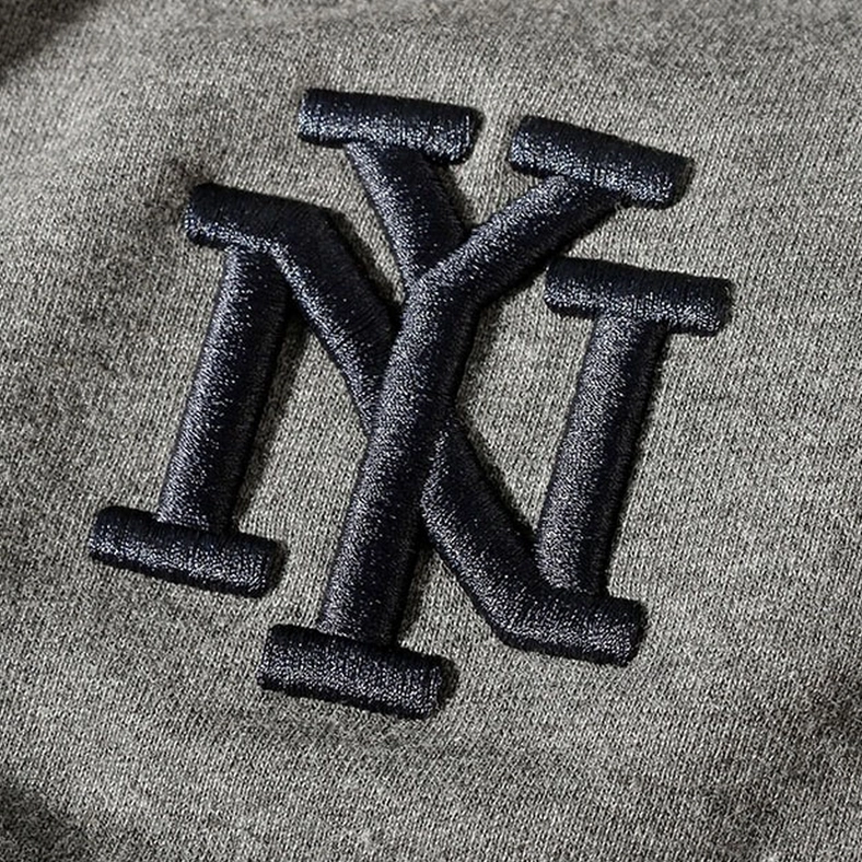 Ribbed knit ankle cuff detail on gothic harem joggers sweatpants, showing tapered leg construction