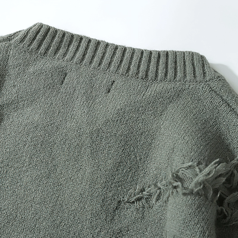 Acrylic knit fabric texture close-up showing soft distressed frayed surface