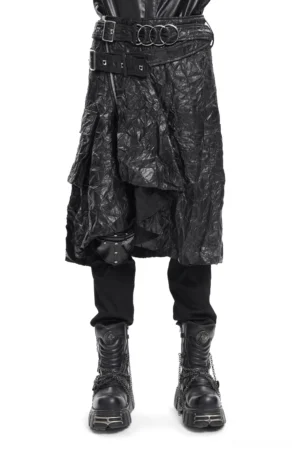 Black crinkled leather gothic kilt front three-quarter view showing multi-ring metal buckle waist belt and asymmetrical layered hem on male model