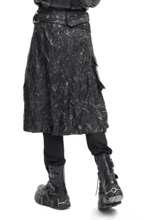 Black crinkled leather gothic kilt side rear view displaying adjustable waist belt and midi-length draped silhouette on male model wearing chain platform boots