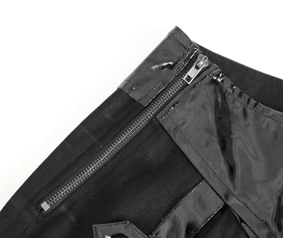 Close-up of gothic kilt side zipper and patent leather overlay details - hardware focus