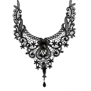Black lace gothic choker necklace with teardrop pendant, front flat lay view showing intricate hollowed lace pattern and oval centerpiece gem