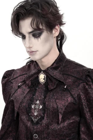 Three-quarter view of burgundy Victorian Gothic cravat neckwear with cameo pendant on male model
