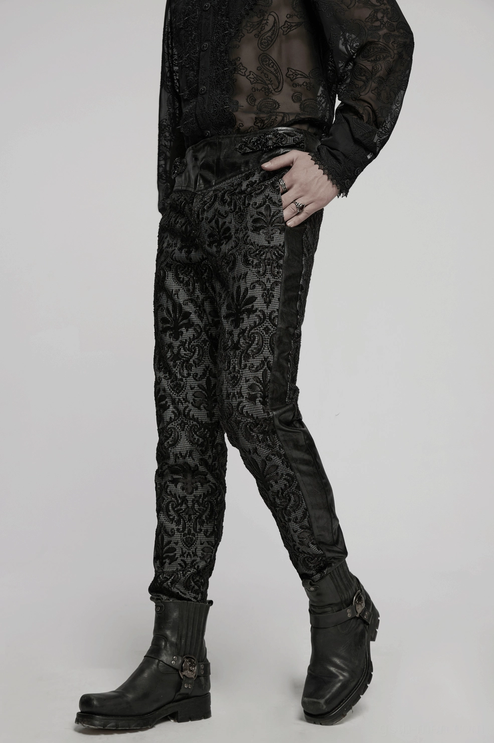 Back waist detail of gothic lace pants with functional pocket design and embroidered lace integration