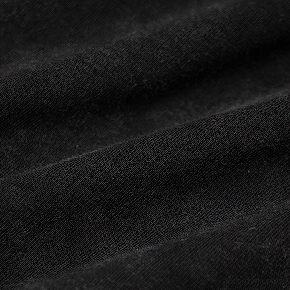 Close-up lace-up fastening detail metal grommets cracked black leather straps woven rope