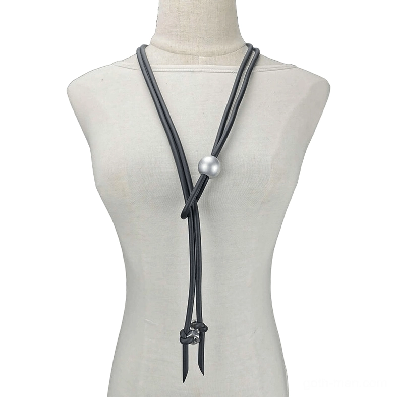 Women's black rubber gothic lariat necklace with pearl and screw accents displayed on dress form mannequin, front view