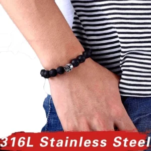 Unisex gothic skull lava stone bracelet worn on male wrist with striped shirt styling