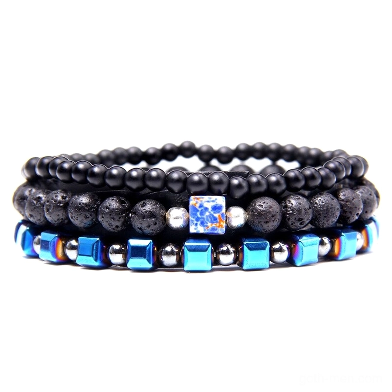 Layered gothic charm bracelet featuring natural stone beads, matte black elements, and celestial blue square accents with metallic details – handmade multi-tier beaded bracelet for alternative style and gothic fashion