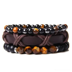 Gothic multi-strand layered bracelet with natural stone beads and braided leather, featuring tiger eye and black stone details in close-up studio view