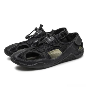 Men's gothic leather ankle-wrap sandals all-black pair front three-quarter view with toggle drawstring closure