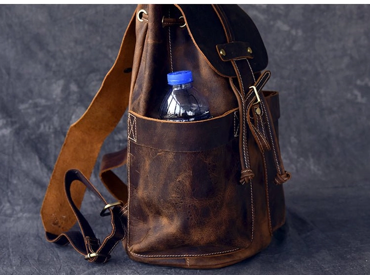 Full back view of genuine leather gothic travel backpack showing complete strap and pocket design structure