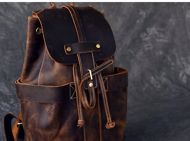 Padded arcuate shoulder strap system of vintage leather gothic backpack showing comfort design