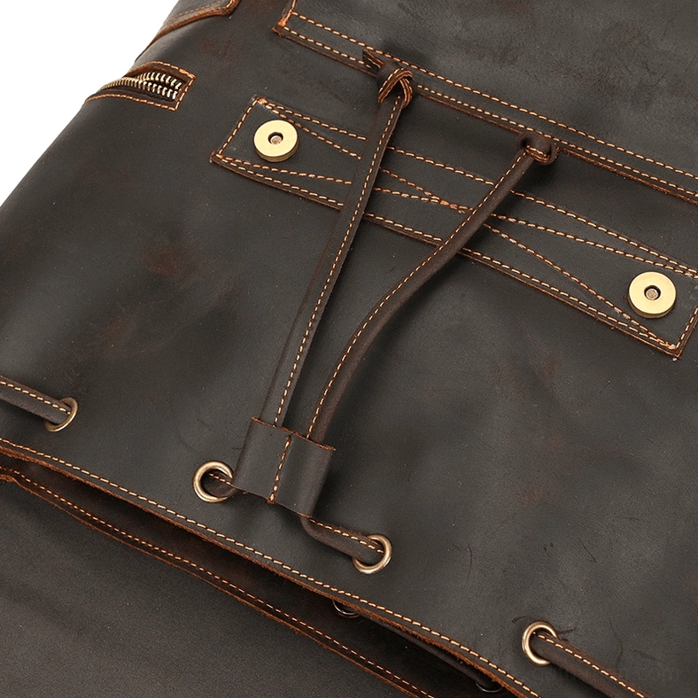 Gothic aesthetic leather backpack with side pocket access and carrying strap configuration