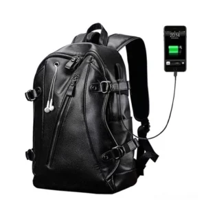Gothic black leather backpack with external USB charging port and earphone outlet, front oblique view showing modern tech integration and premium PU leather construction