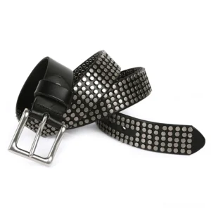 Coiled black leather belt with dense metal rivets showing full rivet pattern detail and texture