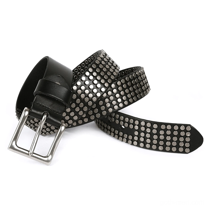 Coiled black leather belt with dense metal rivets showing full rivet pattern detail and texture