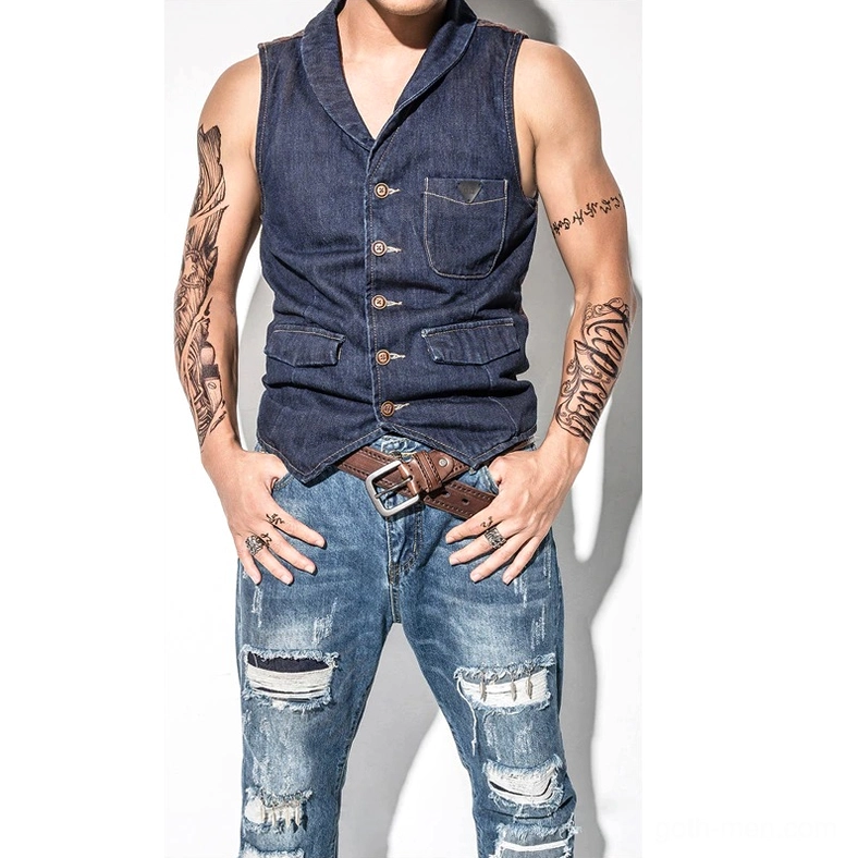 Tattooed male model wearing brown vintage genuine leather gothic belt with metal buckle, waist-level front view on casual denim street style outfit