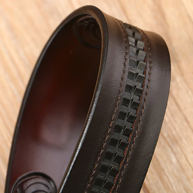 Close-up of dark brown gothic leather belt stitching and edge detail - craftsmanship view