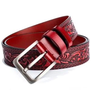 Vintage embossed gothic leather belt with wine red floral pattern and silver buckle, top-down view
