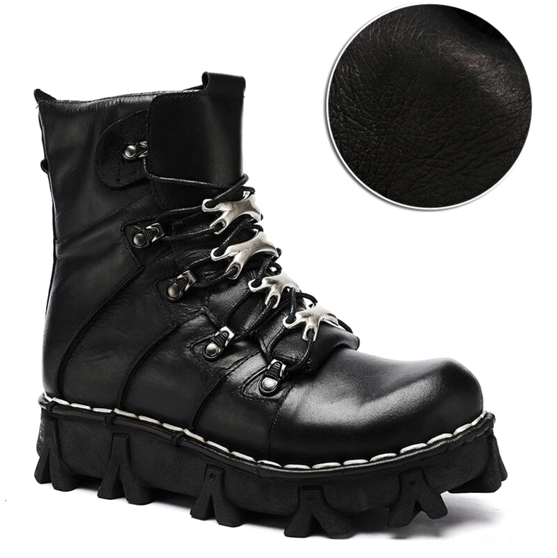 Single black genuine leather gothic ankle boot three-quarter side view with closeup of leather texture and metal lace fasteners