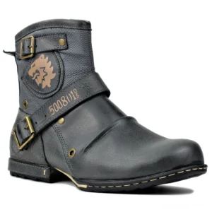 Gothic leather ankle boots with brass buckles and lion emblem, front three-quarter view on white background