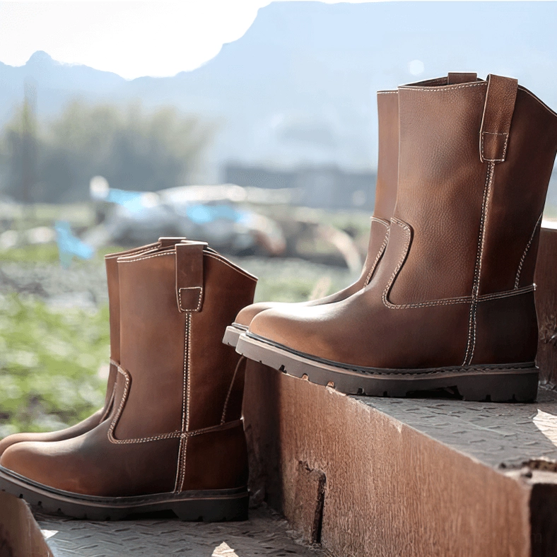 Brown genuine leather gothic mid-calf boots low angle view industrial platform