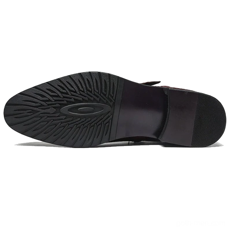 Non-slip rubber outsole of gothic leather ankle boots, sole view showing traction pattern