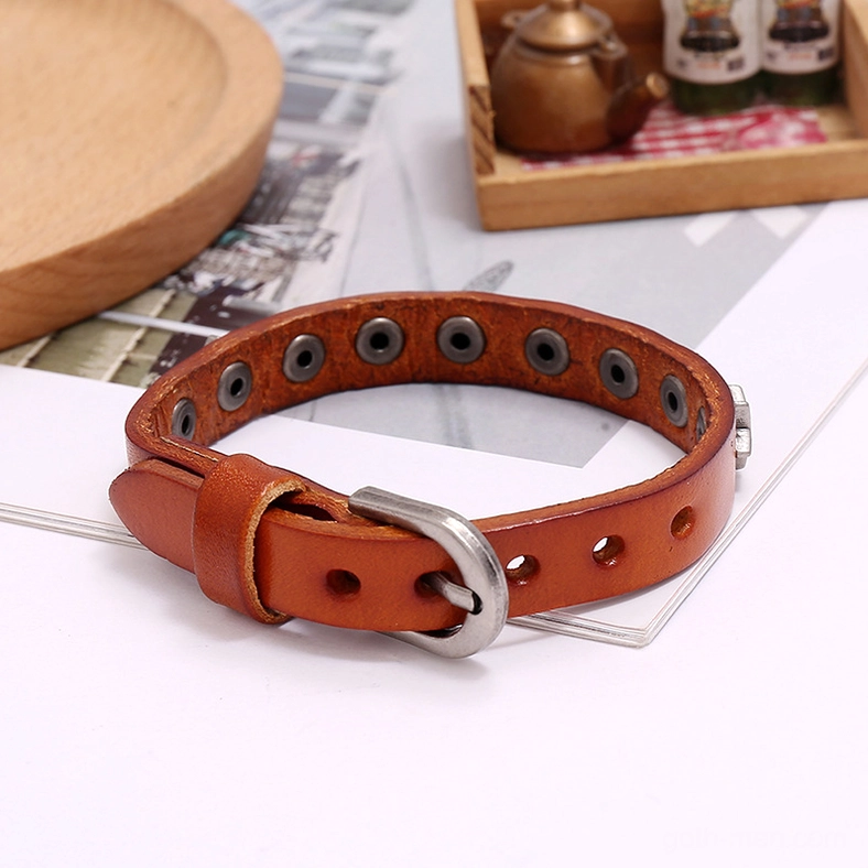Black and brown gothic star leather bracelets showing antique silver plating detail and adjustable snap fastener closure