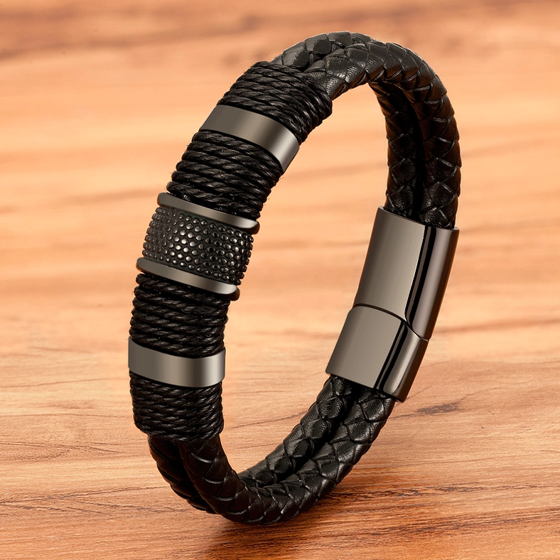 All-black gothic men's leather bracelet displaying woven leather strap and magnetic stainless steel hardware angled