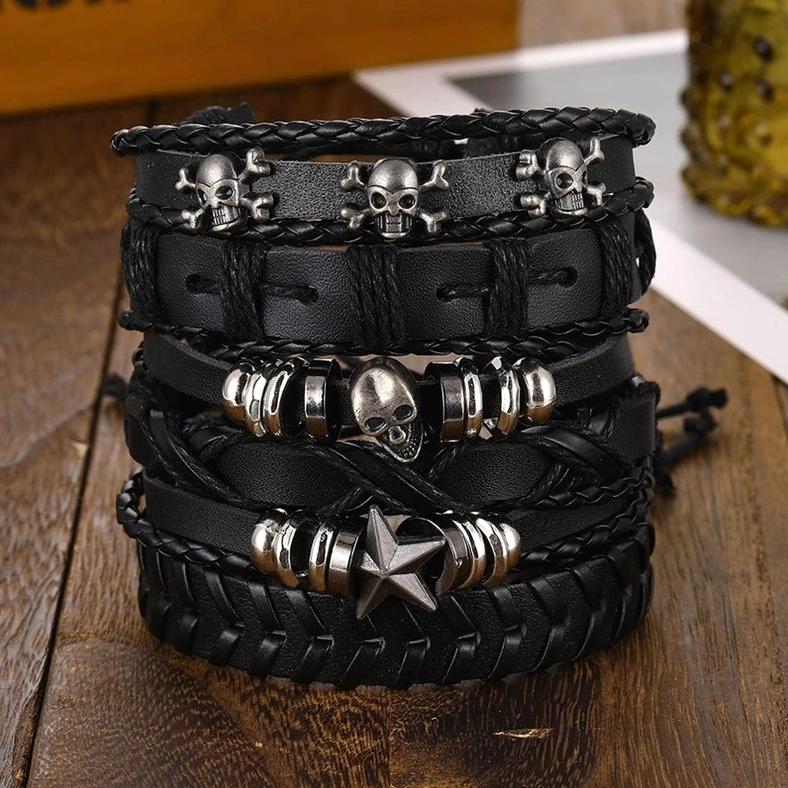 Black gothic leather bracelet set with braided design and metal star charm close up