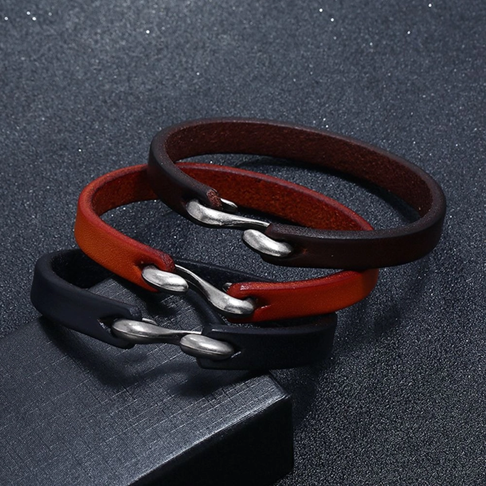 3-piece gothic leather cuff bracelet collection with unified hook clasp design on display base