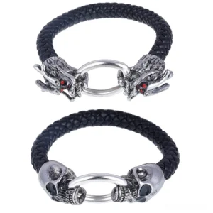 Two gothic leather bracelets displayed in flat lay - silver dragon head and skull metal clasp styles with black braided leather
