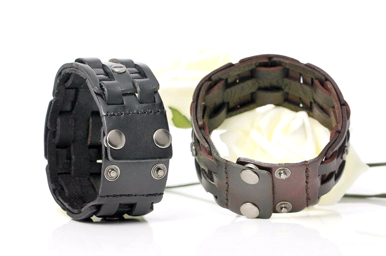 Two gothic leather bracelets showing front and inner construction detail, hand-woven straps with metal rivets and adjustable snap fasteners
